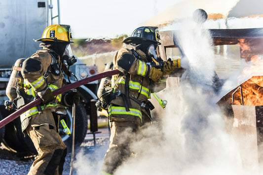 Why Relying on Firefighters Alone May Not Be Enough: How Every Second Counts. Firefighters working together to put out a fire.