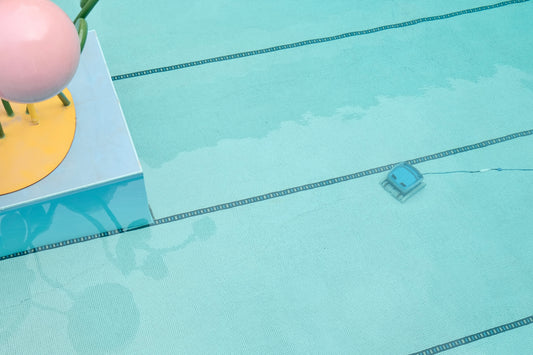 When Preparedness Meets Innovation: How FireFighter1 and LearnMyPool Are Redefining Pool Safety and Fire Awareness. A picture showing a pool vacuum cleaning the bottom of a pool.